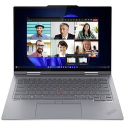 Laptop mit Videokonferenz auf dem Bildschirm und sichtbarer Tastatur.